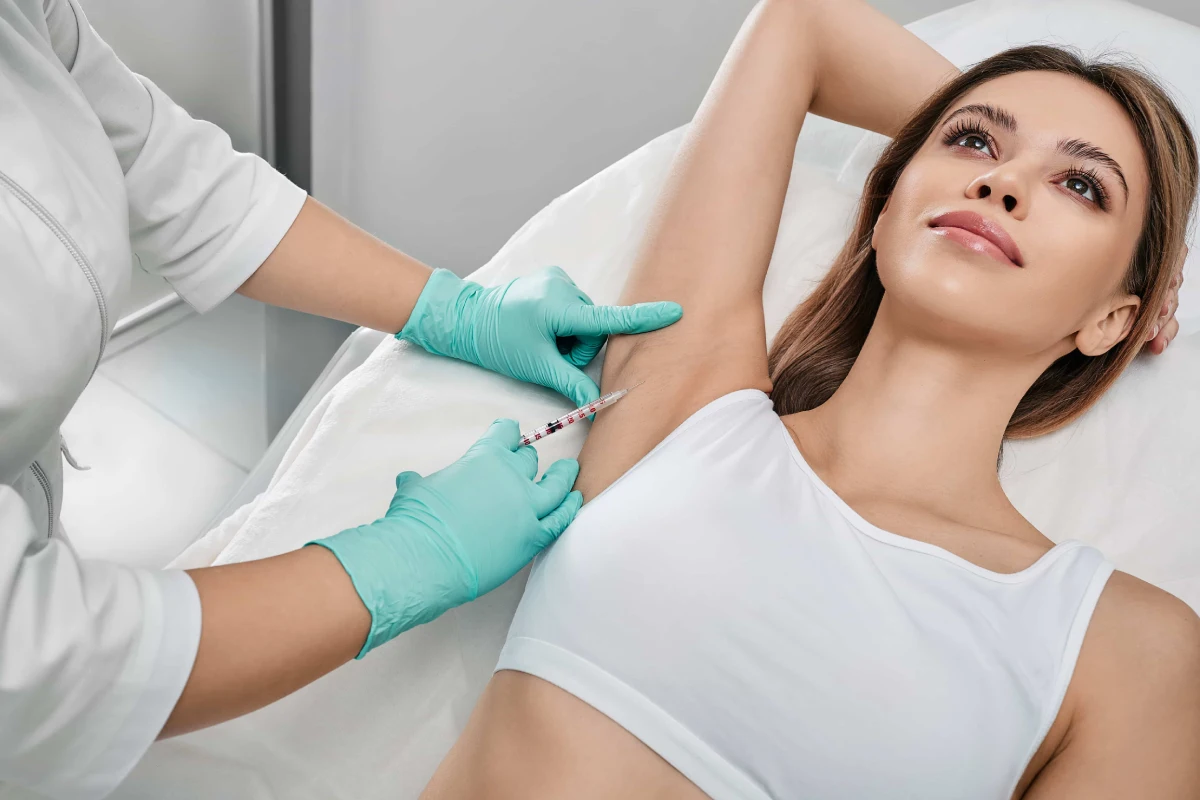 Patient receiving sweat reduction injections in Corpus Christi, TX, for excessive underarm sweating with a non-surgical hyperhidrosis treatment.